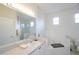 Spacious bathroom with a vanity, bathtub, and mirror at 148 Brunello Dr, Davenport, FL 33897