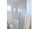 Bright bathroom with a glass-enclosed shower at 148 Brunello Dr, Davenport, FL 33897