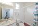 Simple bathroom with a shower/tub combo and striped shower curtain at 148 Brunello Dr, Davenport, FL 33897