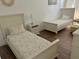 Twin beds in a bright room at 148 Brunello Dr, Davenport, FL 33897