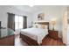 Large bedroom with wooden floors and a king-size bed at 148 Brunello Dr, Davenport, FL 33897