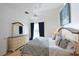 Primary bedroom featuring a king-size bed, stylish decor, and access to the pool area at 148 Brunello Dr, Davenport, FL 33897