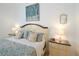 Close-up of the main bedroom's sleeping area with a king-size bed and matching nightstands at 148 Brunello Dr, Davenport, FL 33897