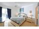 Bright Primary bedroom with a king-size bed, elegant furnishings, and pool access at 148 Brunello Dr, Davenport, FL 33897