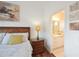 Bedroom featuring wooden furniture and ensuite bathroom access at 148 Brunello Dr, Davenport, FL 33897