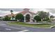 Elegant community entrance with a fountain and lush landscaping at 148 Brunello Dr, Davenport, FL 33897