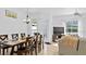 Dining area and living room with access to the backyard at 148 Brunello Dr, Davenport, FL 33897