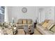 Comfortable living room furnished with plush couches, a coffee table, and natural light at 148 Brunello Dr, Davenport, FL 33897