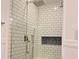 Walk-in shower with white subway tile and glass door at 148 Brunello Dr, Davenport, FL 33897