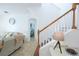 Bright foyer with a staircase, view of the living area, and tasteful decor at 148 Brunello Dr, Davenport, FL 33897