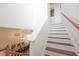 Wooden staircase leading to the second floor at 148 Brunello Dr, Davenport, FL 33897