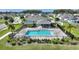 Inviting community pool with surrounding landscaping at 2056 Marabou Dr, Davenport, FL 33896