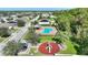 Aerial view showing community pool, playground, and residential area at 2056 Marabou Dr, Davenport, FL 33896