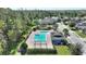 Aerial view of community pool, playground, and surrounding homes at 2056 Marabou Dr, Davenport, FL 33896
