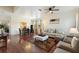 Living room featuring hardwood floors and ample seating at 2056 Marabou Dr, Davenport, FL 33896
