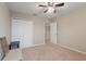 Spacious bedroom with double door closet and ceiling fan at 2056 Marabou Dr, Davenport, FL 33896