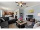 Open living area with sectional sofa and a view into the kitchen at 2056 Marabou Dr, Davenport, FL 33896