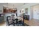 Open kitchen with island and breakfast bar, view to dining area at 2056 Marabou Dr, Davenport, FL 33896