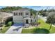 Two-story house with a landscaped yard at 2056 Marabou Dr, Davenport, FL 33896