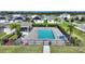 Relaxing community pool with lounge chairs and gazebo at 2056 Marabou Dr, Davenport, FL 33896