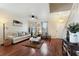 Living room with hardwood floors, comfortable seating, and plenty of natural light at 2056 Marabou Dr, Davenport, FL 33896