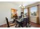 Formal dining room with hardwood floors and a lovely chandelier at 2056 Marabou Dr, Davenport, FL 33896