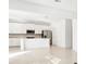 Open concept kitchen with white cabinets at 27472 Black Kite Ave, Howey In The Hills, FL 34737