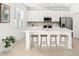Modern kitchen featuring white cabinets and an island at 27472 Black Kite Ave, Howey In The Hills, FL 34737