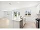 Open kitchen with island and view to backyard at 27472 Black Kite Ave, Howey In The Hills, FL 34737