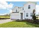 Two-story house with a gray exterior and brick driveway at 27472 Black Kite Ave, Howey In The Hills, FL 34737