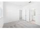 Bright bedroom with gray carpeting and ensuite bathroom at 27472 Black Kite Ave, Howey In The Hills, FL 34737