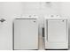 Laundry room with side-by-side Samsung washer and dryer at 27472 Black Kite Ave, Howey In The Hills, FL 34737