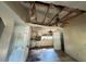 Damage to the living room ceiling and flooring at 3814 Ne 5Th St, Ocala, FL 34470