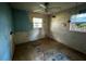 Bedroom with window and ceiling fan needs significant repairs at 3814 Ne 5Th St, Ocala, FL 34470