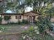 House exterior with a front yard and garden at 3814 Ne 5Th St, Ocala, FL 34470