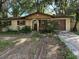 Front view of a ranch house needing some landscaping work at 3814 Ne 5Th St, Ocala, FL 34470