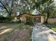 Front view of a house with a driveway at 3814 Ne 5Th St, Ocala, FL 34470