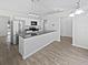 Spacious kitchen with light cabinets and granite countertops at 5119 Timber Ridge Trl, Ocoee, FL 34761