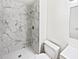 Bathroom boasts a walk-in shower with marble tile at 5119 Timber Ridge Trl, Ocoee, FL 34761