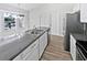 Modern kitchen with white cabinets and granite countertops at 5119 Timber Ridge Trl, Ocoee, FL 34761