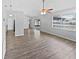 Spacious living room featuring wood-look floors and access to patio at 5119 Timber Ridge Trl, Ocoee, FL 34761