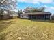 Large backyard with grassy area and screened porch at 5119 Timber Ridge Trl, Ocoee, FL 34761