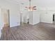 Open living area with wood-look floors and ceiling fan at 5119 Timber Ridge Trl, Ocoee, FL 34761