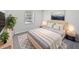 Cozy bedroom with light walls, a queen bed, and wood-look floors at 5119 Timber Ridge Trl, Ocoee, FL 34761