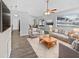 Bright living room with comfy seating and wood-look floors at 5119 Timber Ridge Trl, Ocoee, FL 34761