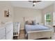 Charming bedroom with a crib and full bed, perfect for a Bedroom at 5364 Ragusa Loop, Saint Cloud, FL 34771