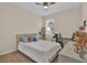 Serene bedroom with a queen-size bed and a workspace at 5364 Ragusa Loop, Saint Cloud, FL 34771