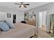 Spacious bedroom with a dresser and large bed at 5364 Ragusa Loop, Saint Cloud, FL 34771