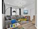 Fun playroom with sectional sofa, toys, and a TV at 5364 Ragusa Loop, Saint Cloud, FL 34771