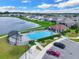 Community pool with cabana and surrounding landscape at 5364 Ragusa Loop, Saint Cloud, FL 34771